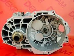 Cleaned and open Ford EcoSport gearbox housing displayed against a red DEKRA background, showing internal structure
