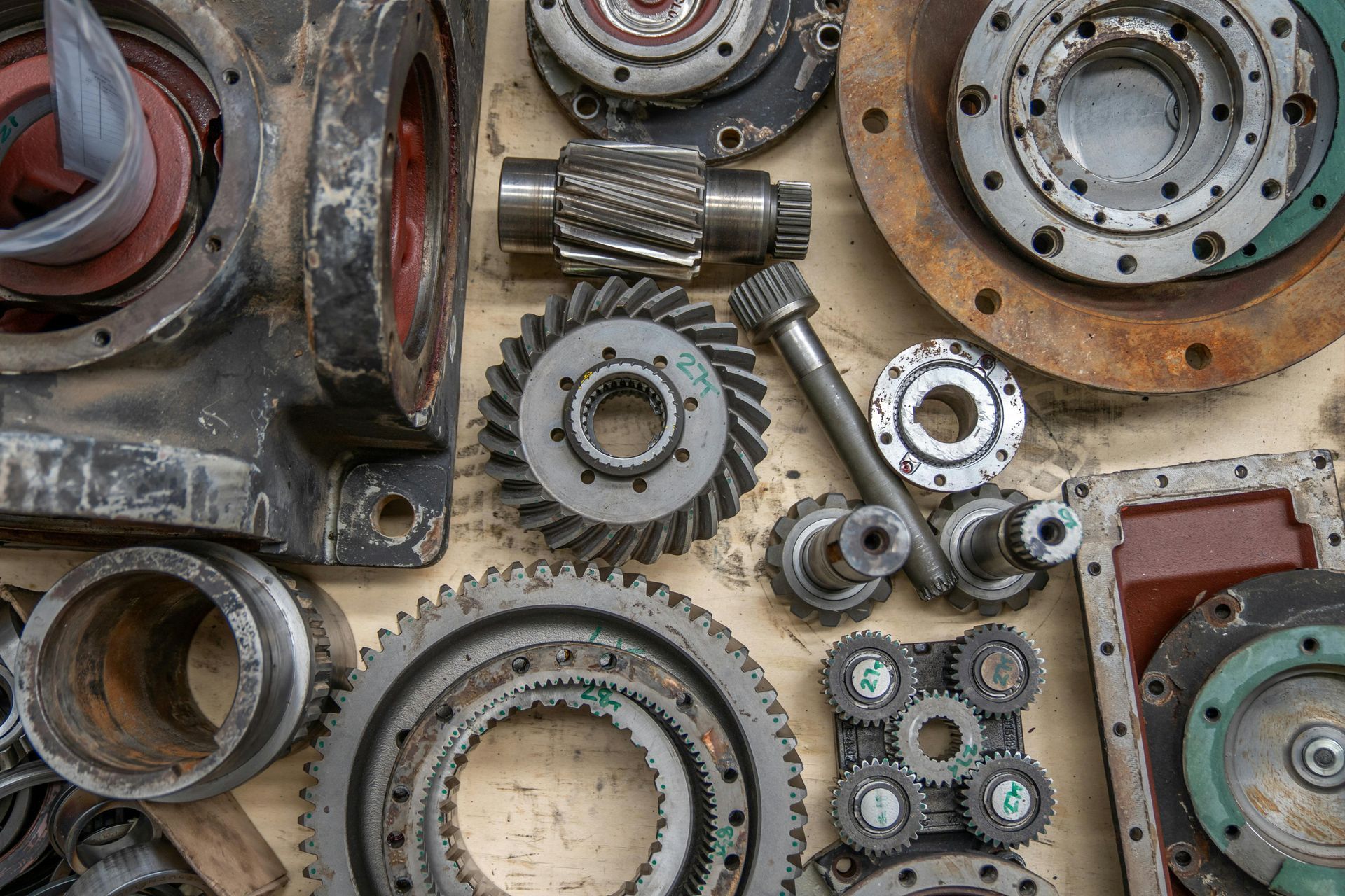 Gearbox parts and transmission components laid out for repair.