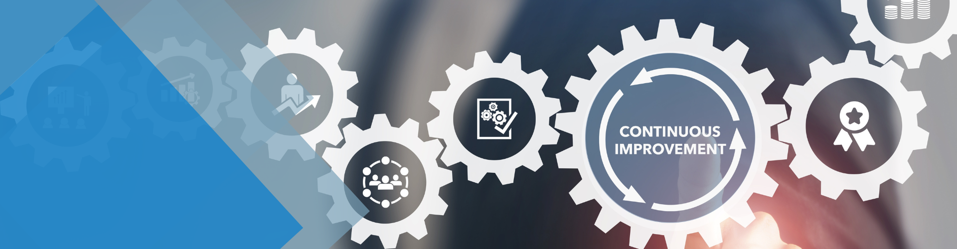 Gears with icons representing a business cycle: strategy, document, vision, and quality. Blue and gray background.