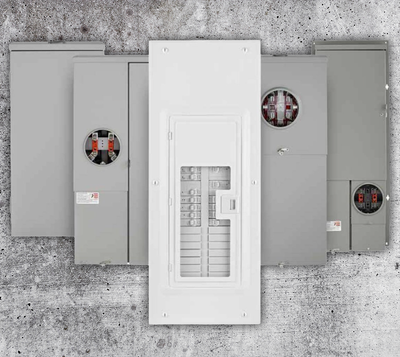 Three electrical panels on a concrete wall, with a white breaker panel centered in front.