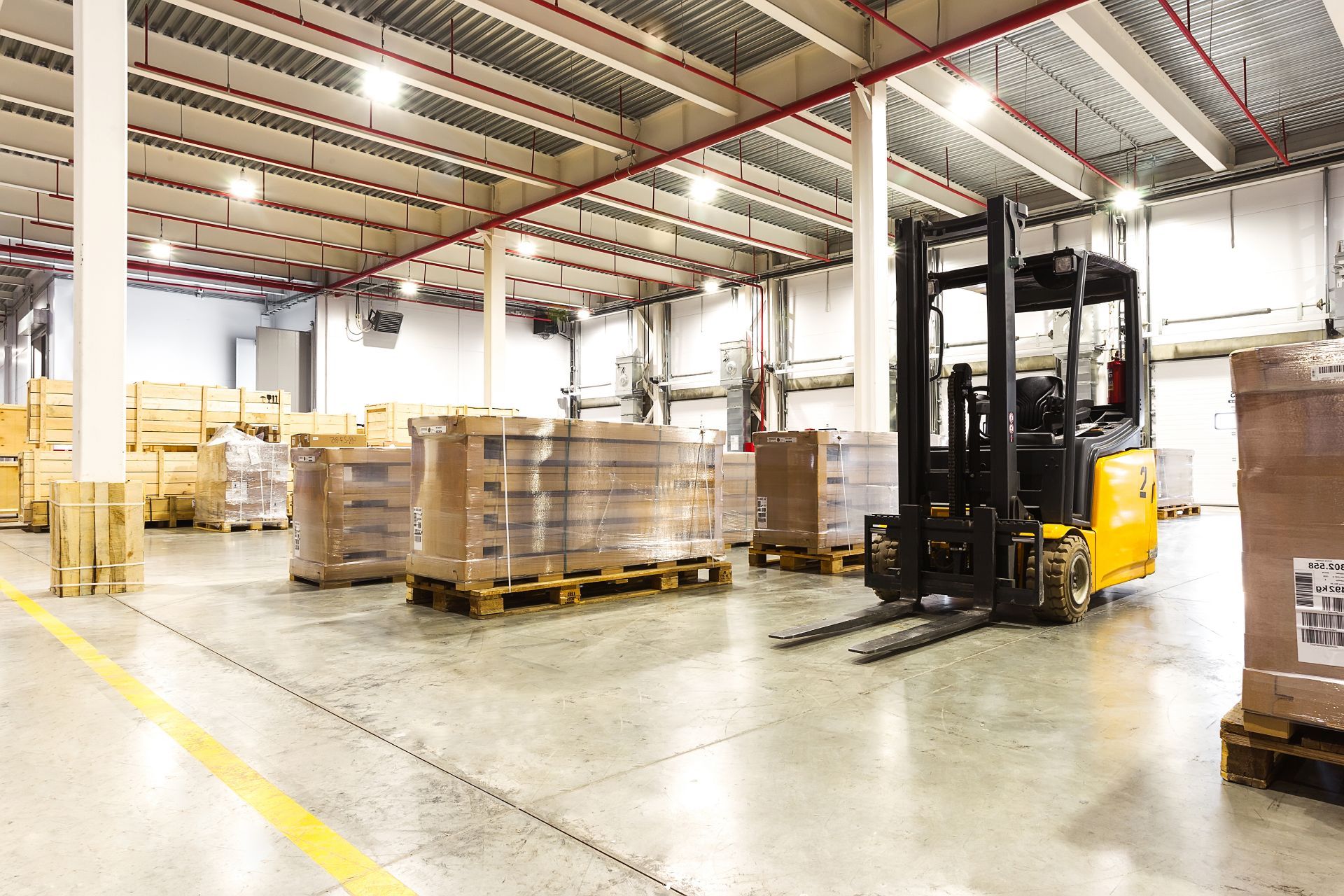 Warehouse with pallets and fork lift
