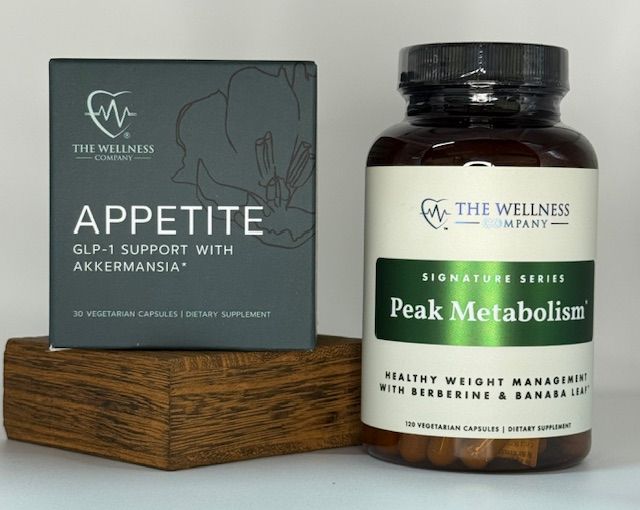 Two supplement bottles on a wooden block: 