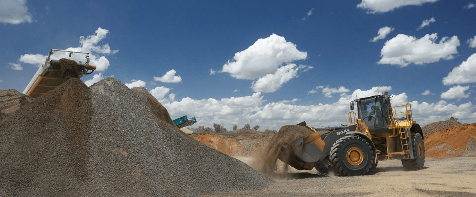 Excavator Moving Gravel In Quarry — Quarry Products In Moranbah, QLD