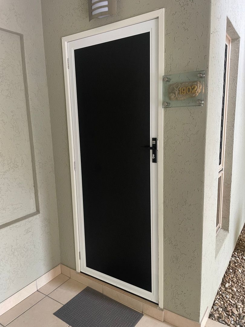 A Close Up of a Sliding Screen Door With a Handle — A1 Security Screens Cairns In Manunda, QLD