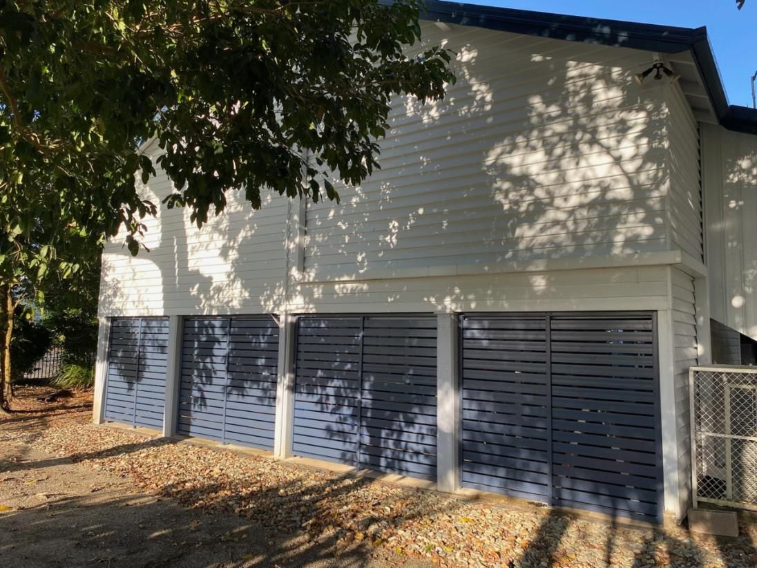 A Door With a Floral Design on It is Open in a Room — A1 Security Screens Cairns In Manunda, QLD