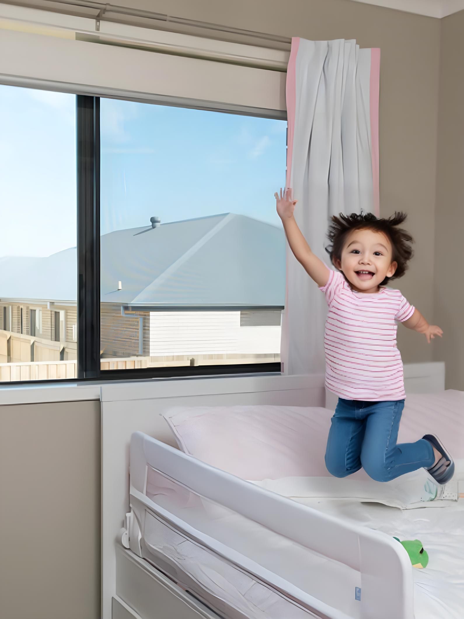 A Little Girl is Jumping on a Bed in a Bedroom — A1 Security Screens Cairns In Manunda, QLD