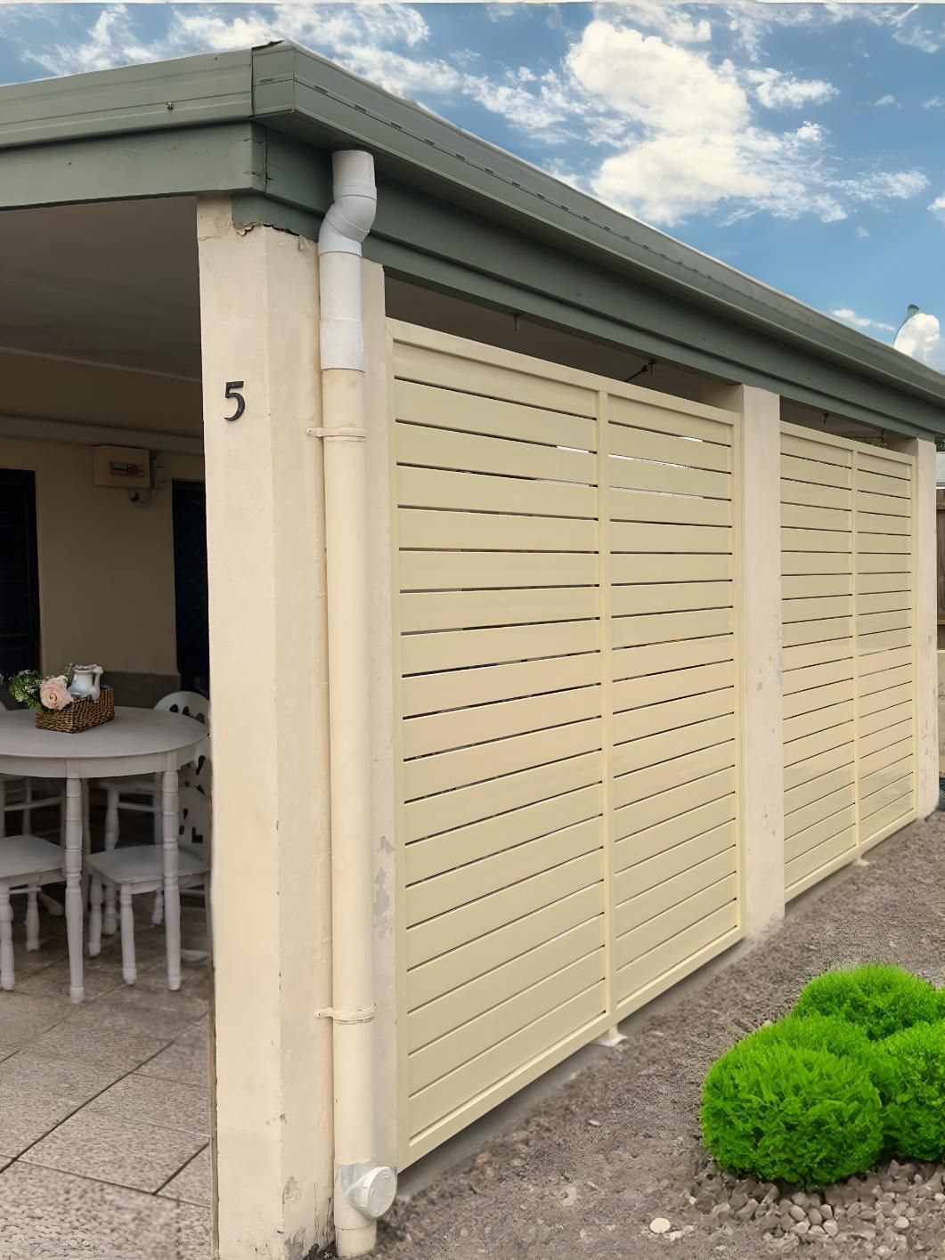 A Building With a Balcony and a Palm Tree in the Background — A1 Security Screens Cairns In Manunda, QLD