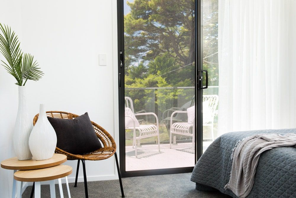 Four Screens Are Stacked on Top of Each Other on a Checkered Floor — A1 Security Screens Cairns in Palm Cove, QLD