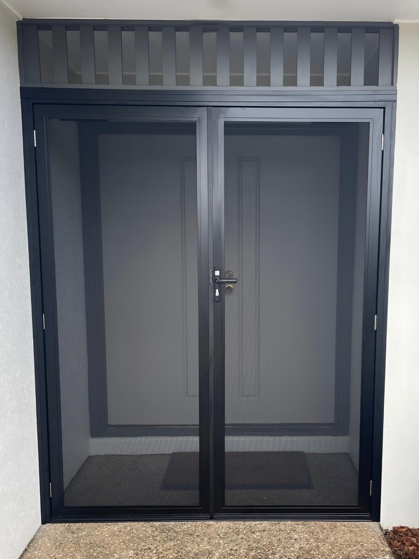 A House With a Brown Door and a Walkway Leading to It — A1 Security Screens Cairns In Manunda, QLD