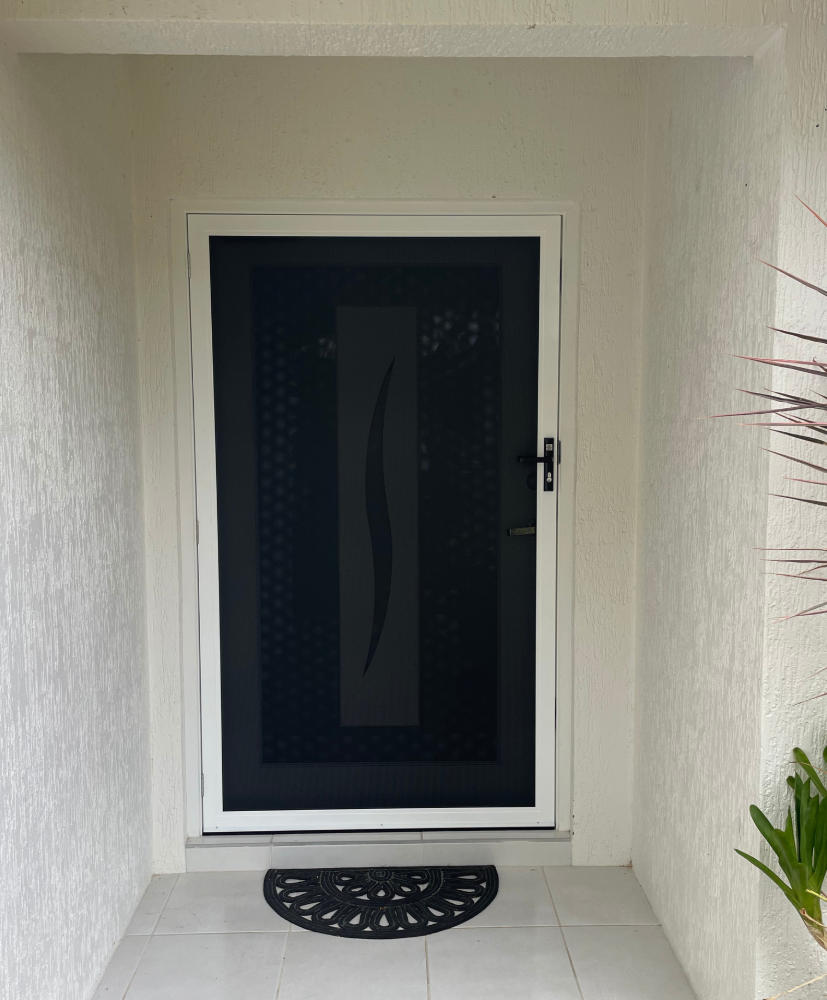 A Screened in Window With a Clock on the Wall Behind It — A1 Security Screens Cairns In Manunda, QLD