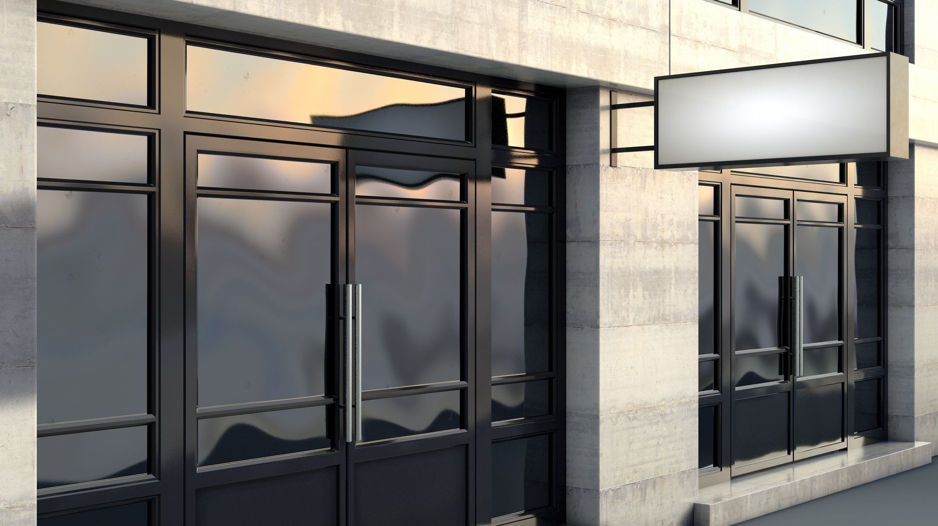 Modern storefront with glass doors and blank rectangular sign above entrance.