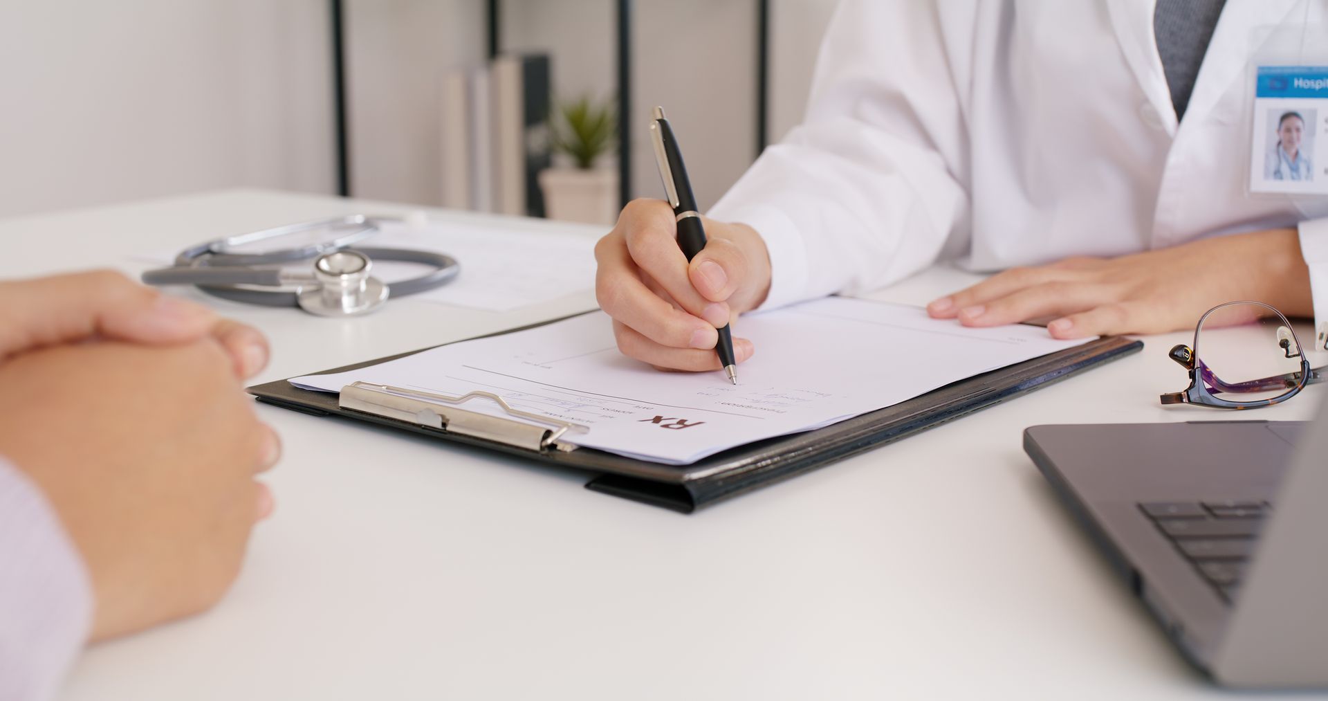Waiting area with chairs, windows, and a dog statue.