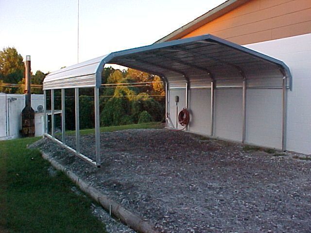 A carport with a blue roof on a white background.