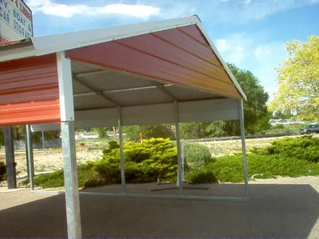 A side-by-side comparison of a modern steel carport and a rustic wooden carport.