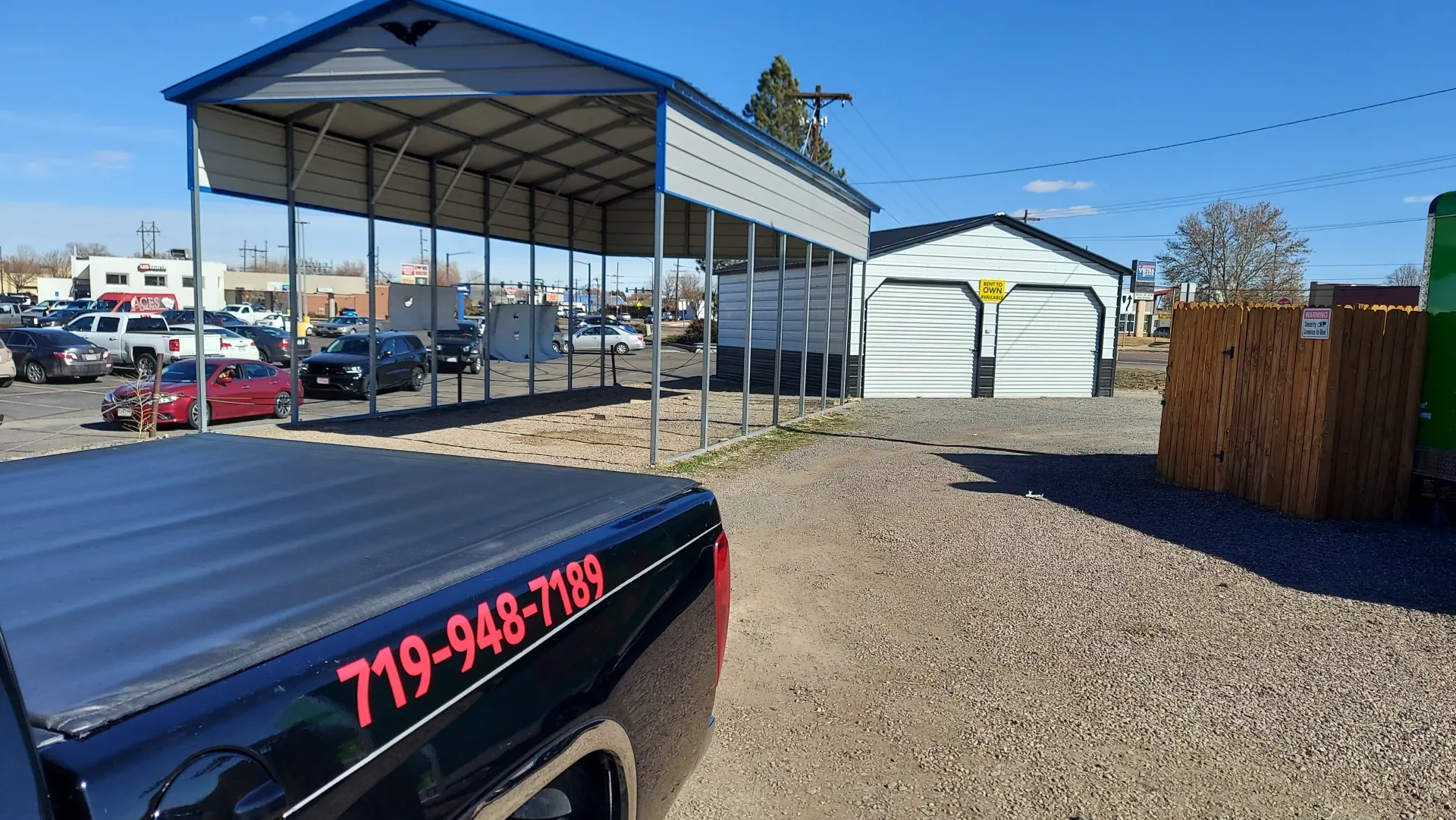 Interior view of steel carport showing galvanized metal framework and roofing panels
