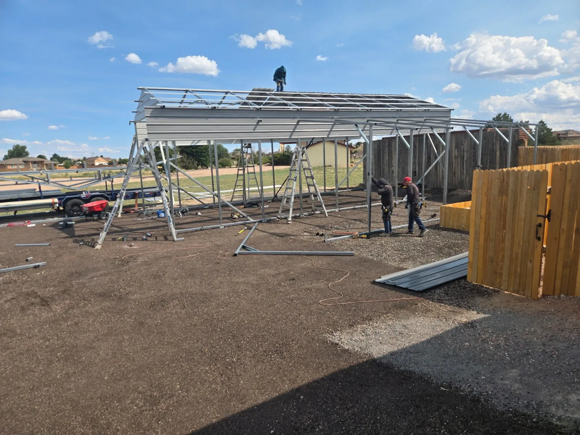 Carport builder welding joints to create a sturdy final product