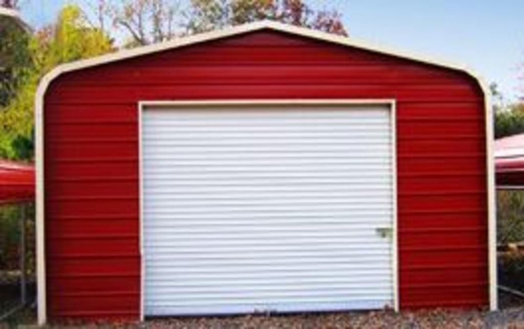 A red garage with a white garage door.