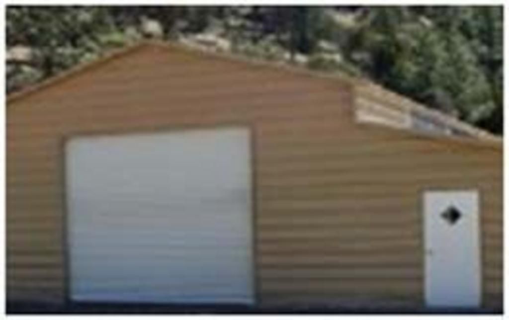 A brown garage with a white door and a white garage door.