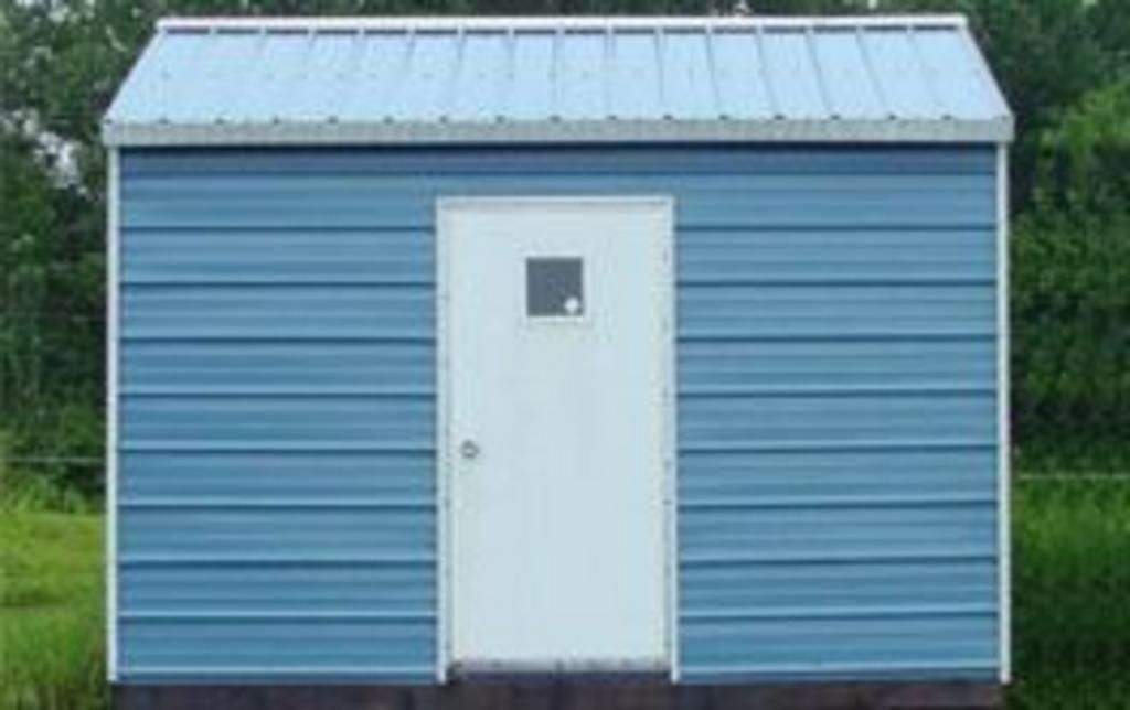 A blue metal shed with a white door and window.