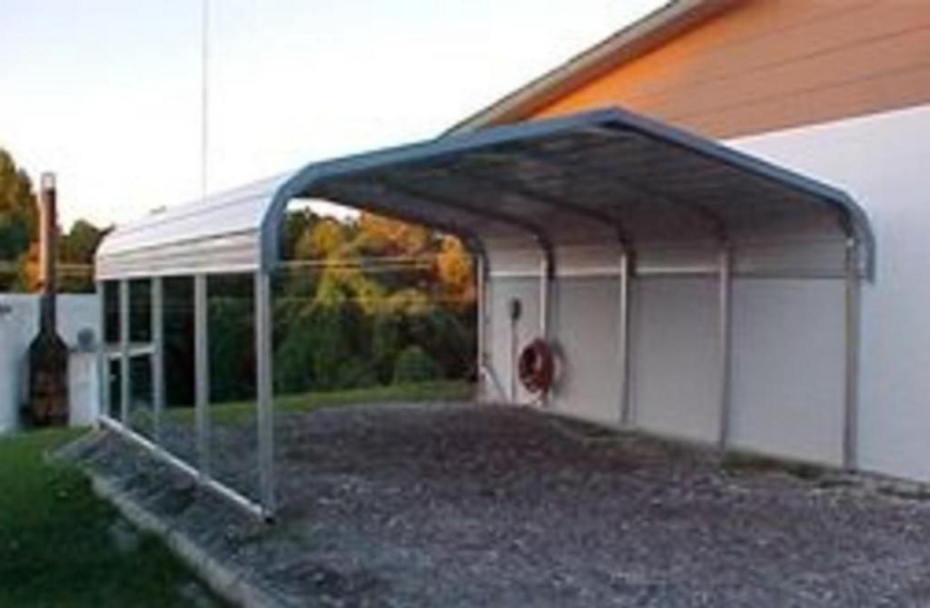 A carport is attached to the side of a house.