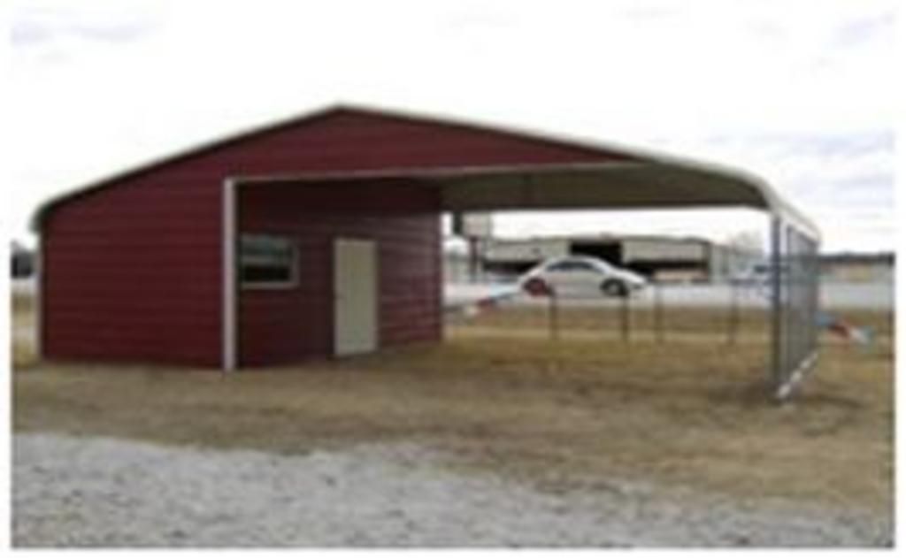 A red barn with a carport attached to it