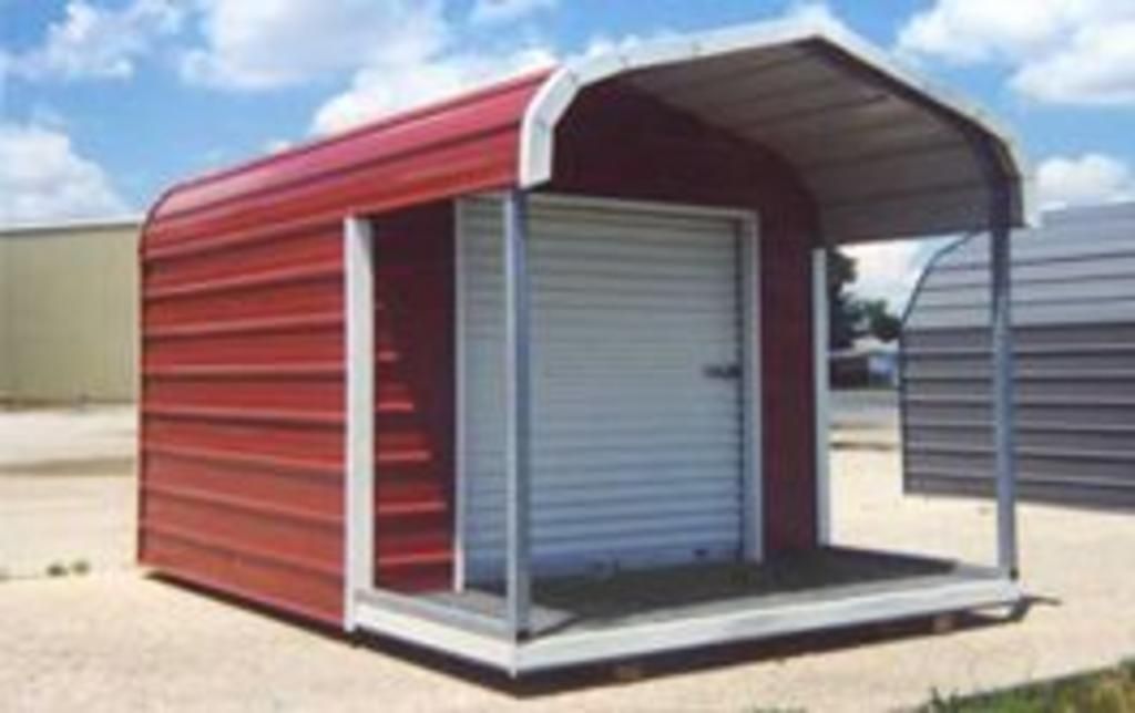 A red and white shed with a white door