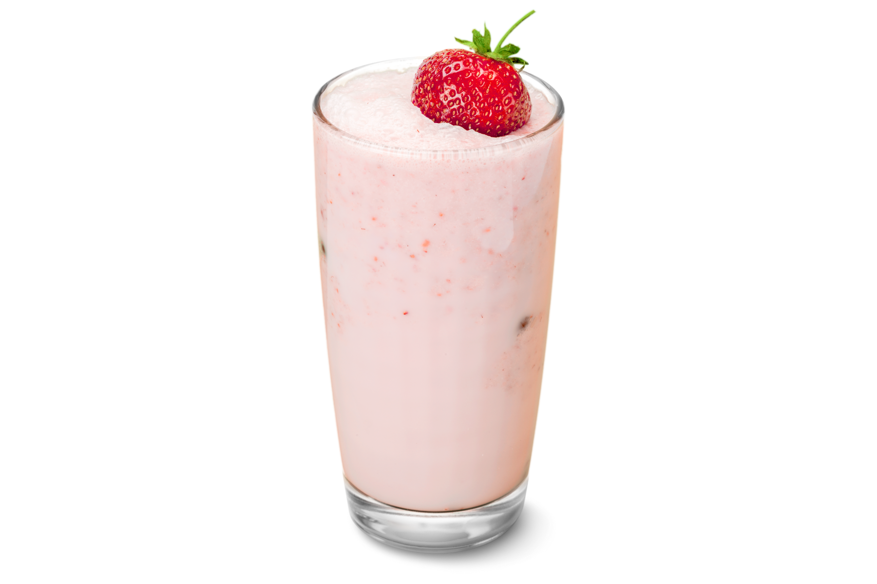 Strawberry milkshake in a glass, topped with a fresh strawberry.