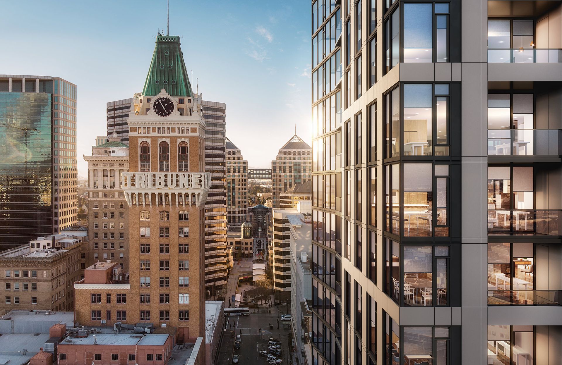 An aerial view of a city with a clock tower in the background