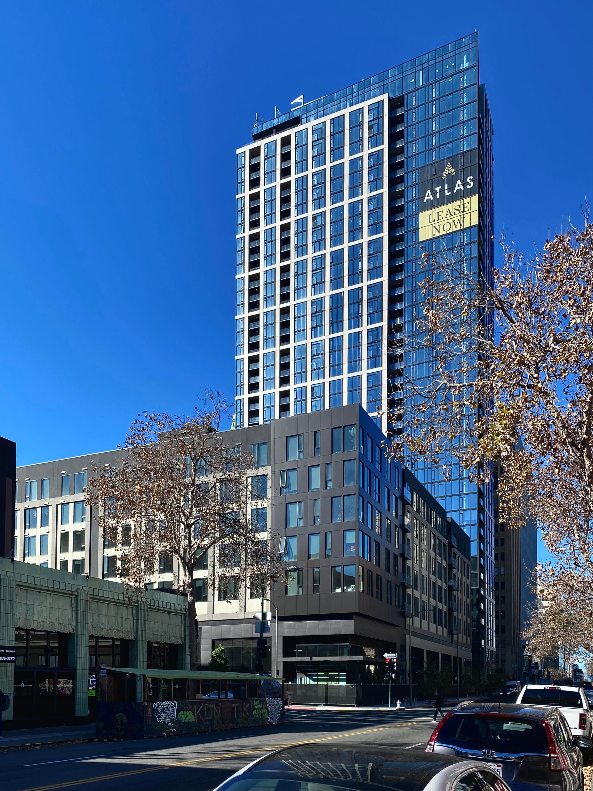 A tall building with the word atlas on it