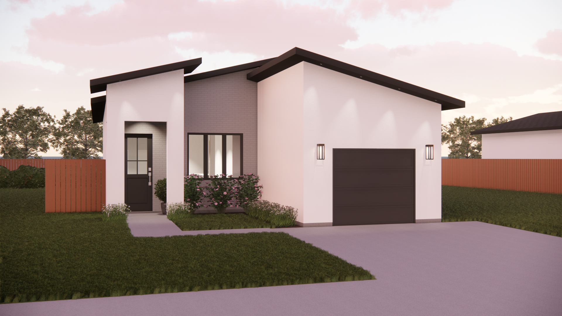 A white house with a black garage door and a fence in front of it.