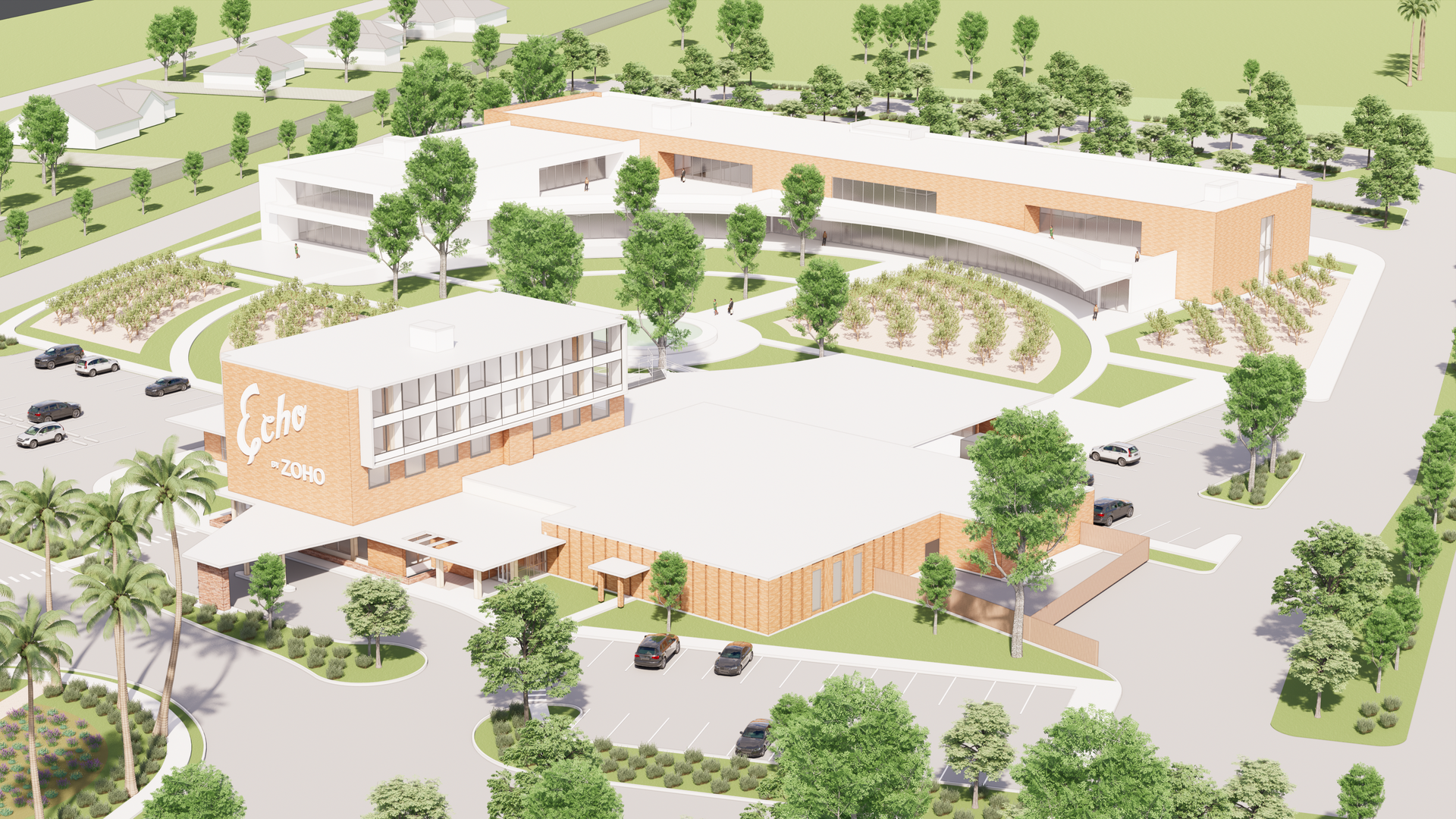 An aerial view of a large building surrounded by trees and a parking lot.