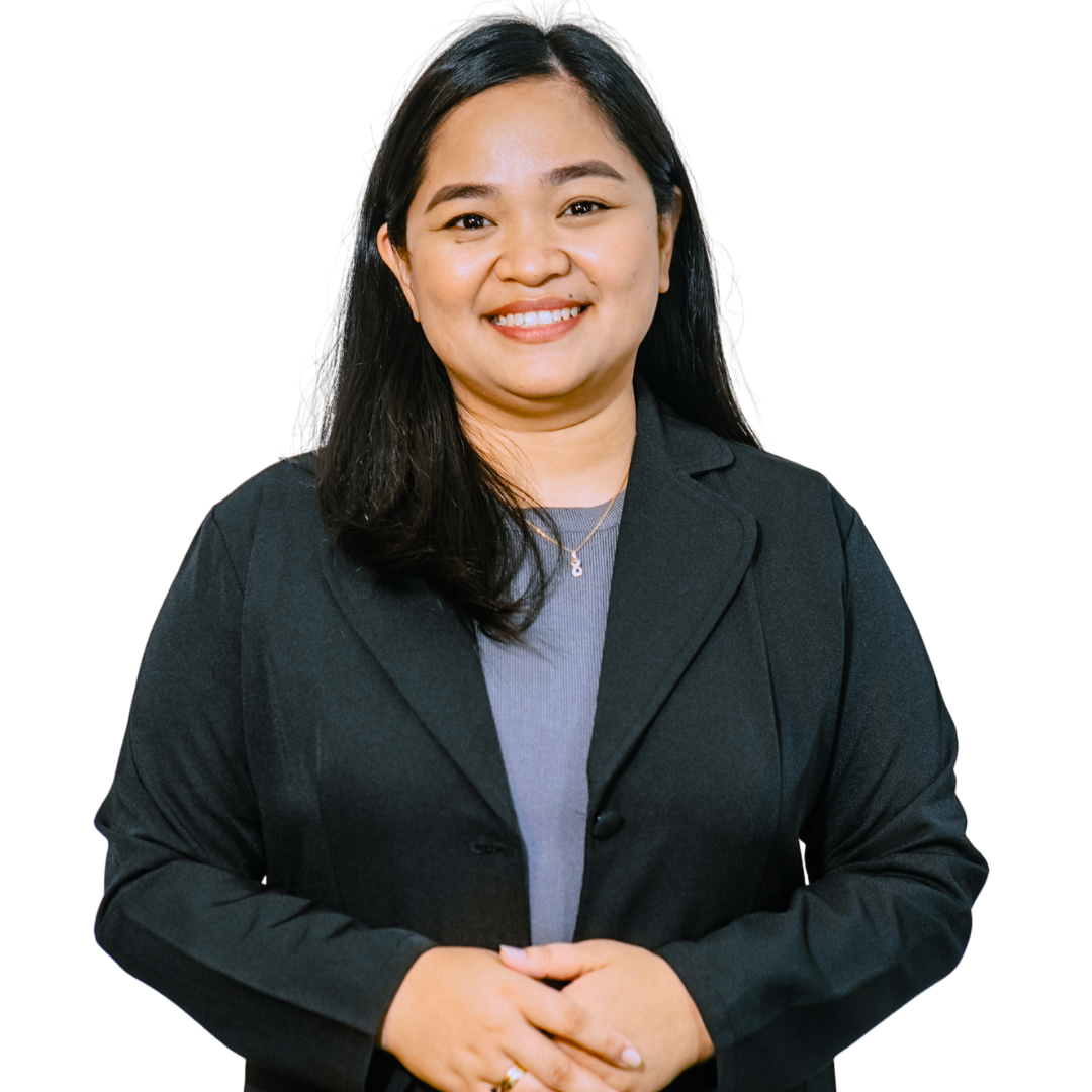 Woman with dark hair and a blazer, smiling and looking at the camera.