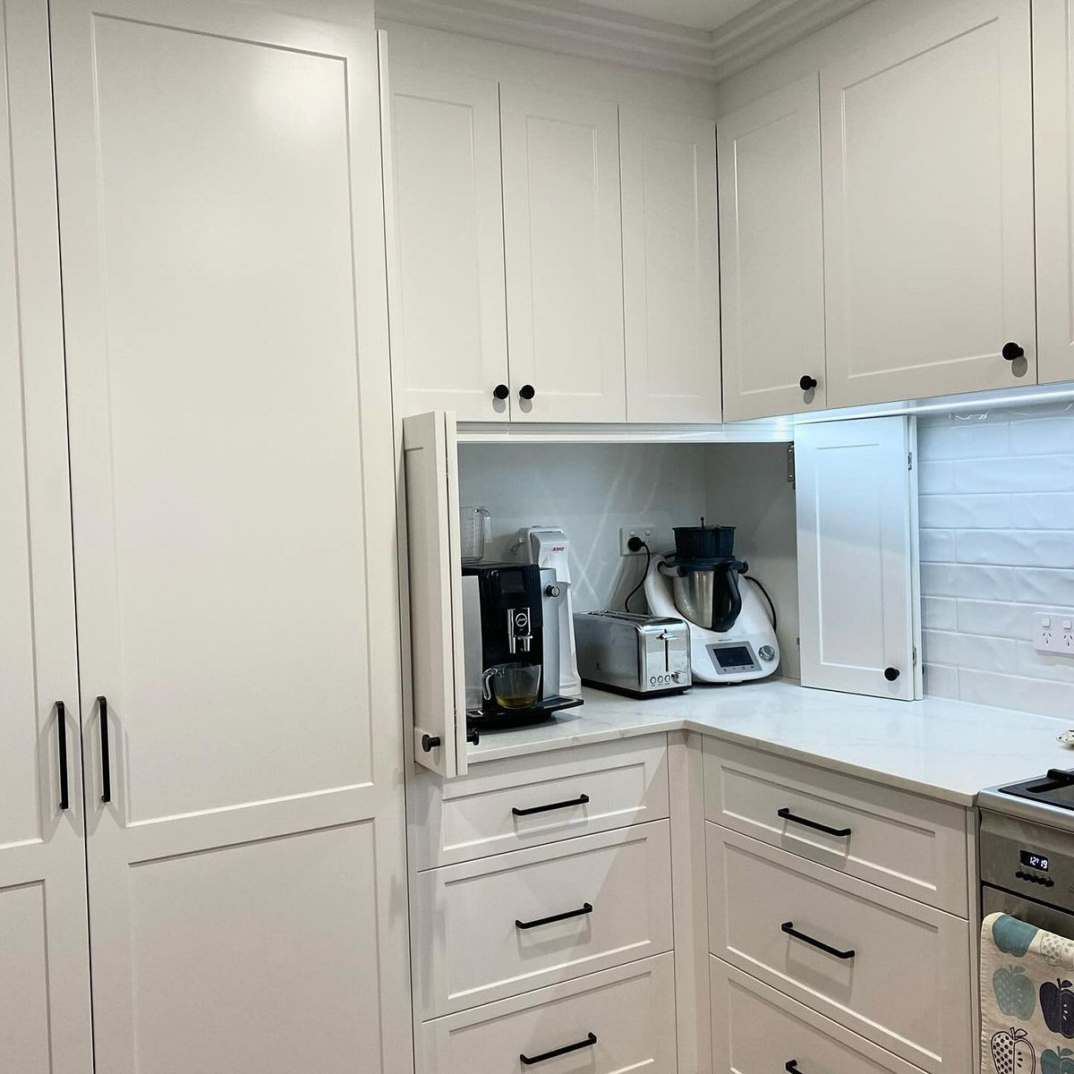 A Kitchen With White Cabinets, Drawers, And Appliances — Kreuzer Cabinets In East Wagga Wagga, NSW