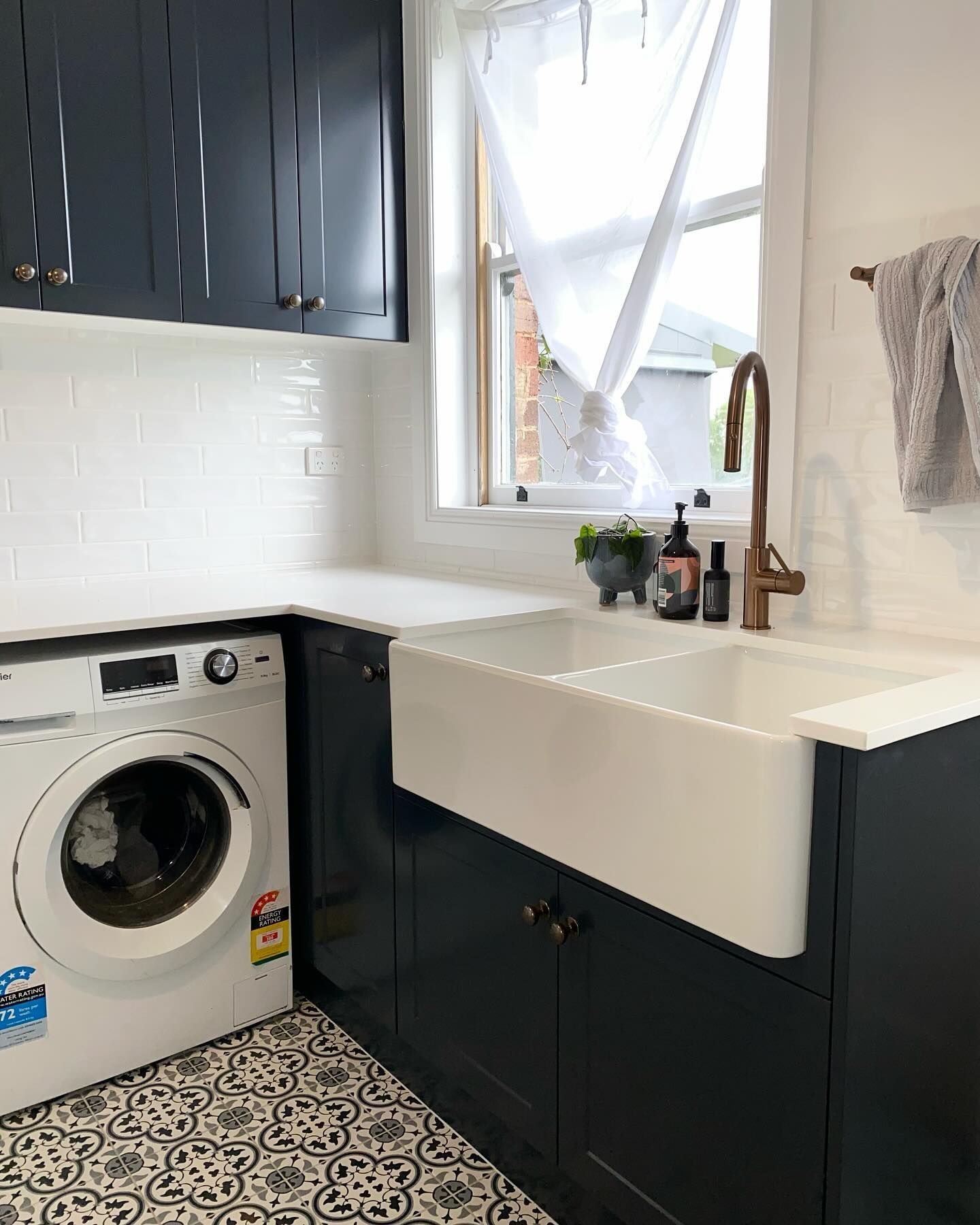 A Laundry Room With a Washer and Dryer and a Sink — Kreuzer Cabinets In East Wagga Wagga, NSW