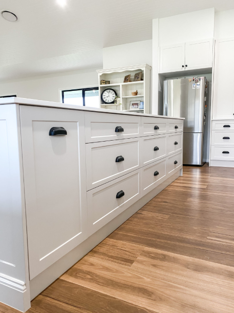 A Kitchen With White Cabinets, Wooden Floors, and a Refrigerator — Kreuzer Cabinets In East Wagga Wagga, NSW