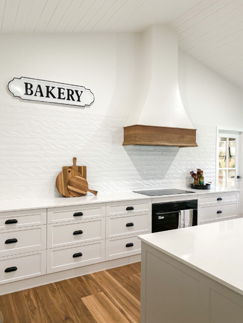 A Kitchen With White Cabinets and a Sign That Says Bakery on the Wall — Kreuzer Cabinets In East Wagga Wagga, NSW
