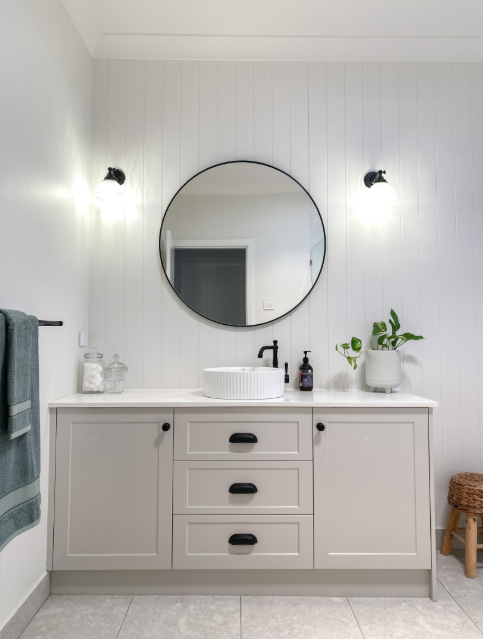 A Bathroom With a Sink, Mirror and Cabinets — Kreuzer Cabinets In East Wagga Wagga, NSW
