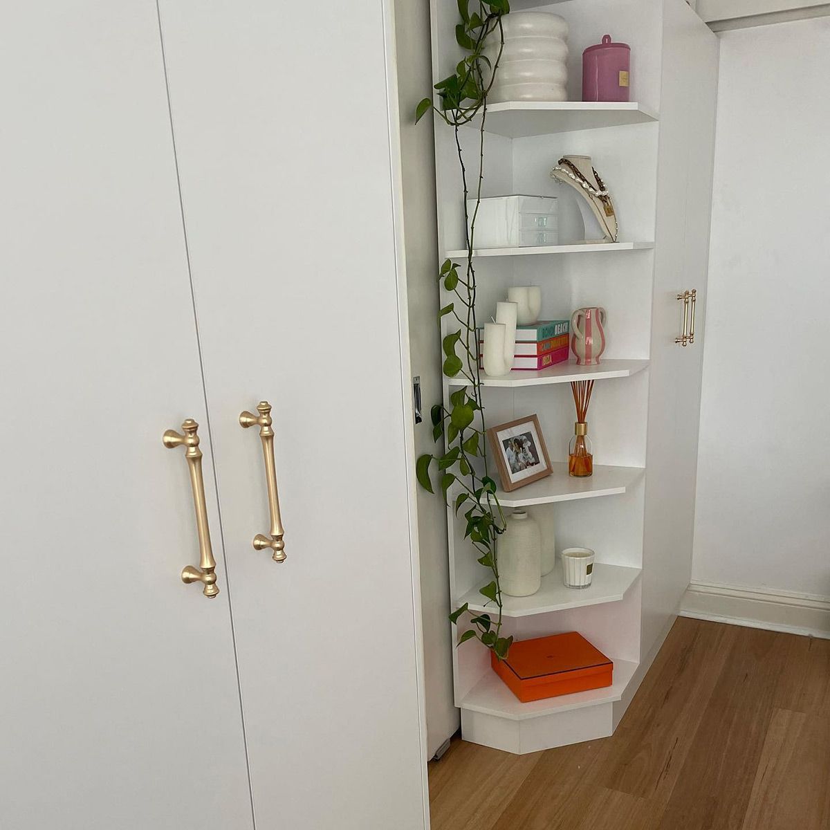 A White Cabinet With Gold Handles And Shelves — Kreuzer Cabinets In East Wagga Wagga, NSW