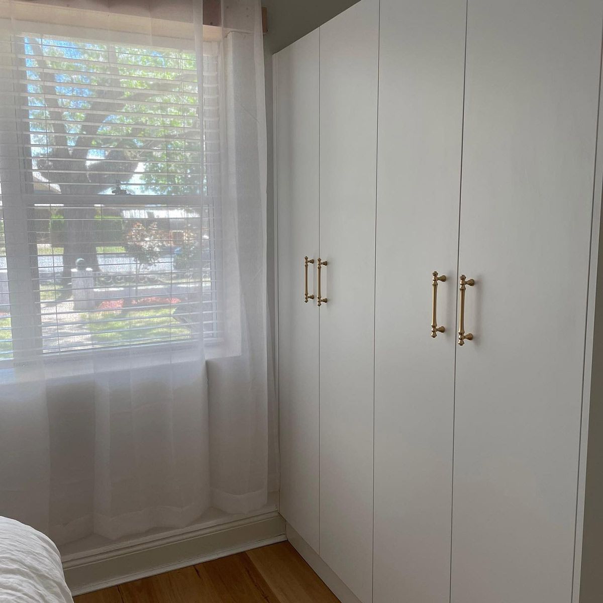 A Bedroom With White Cabinets And A Window With Blinds — Kreuzer Cabinets In East Wagga Wagga, NSW