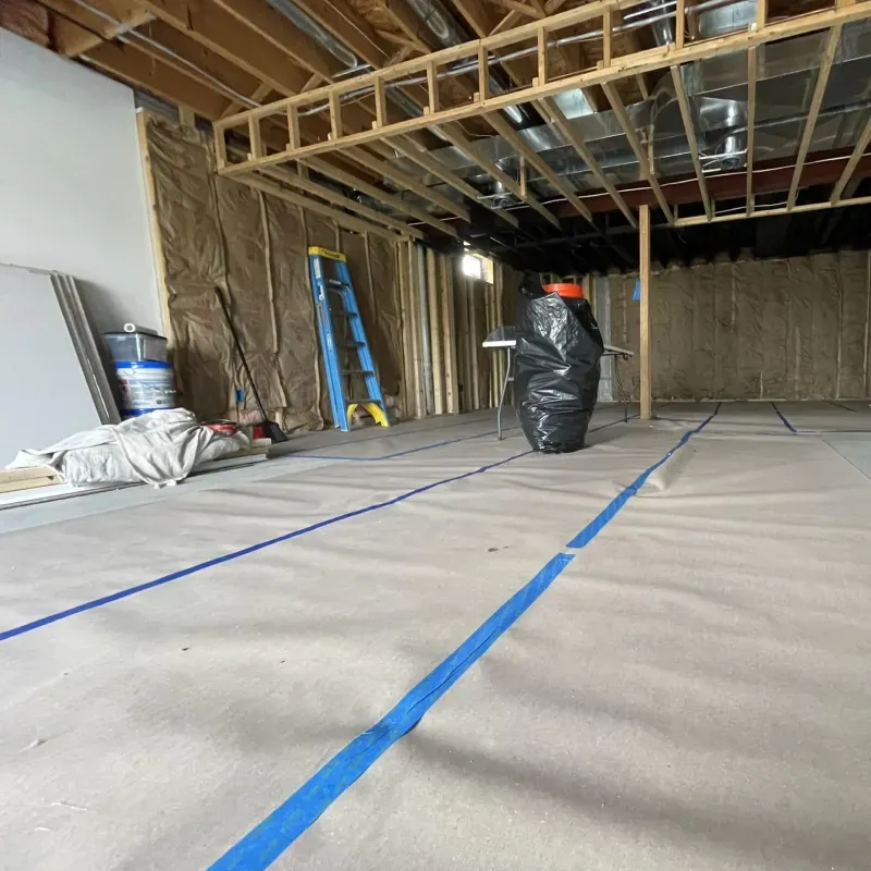 A room under construction with blue lines on the floor