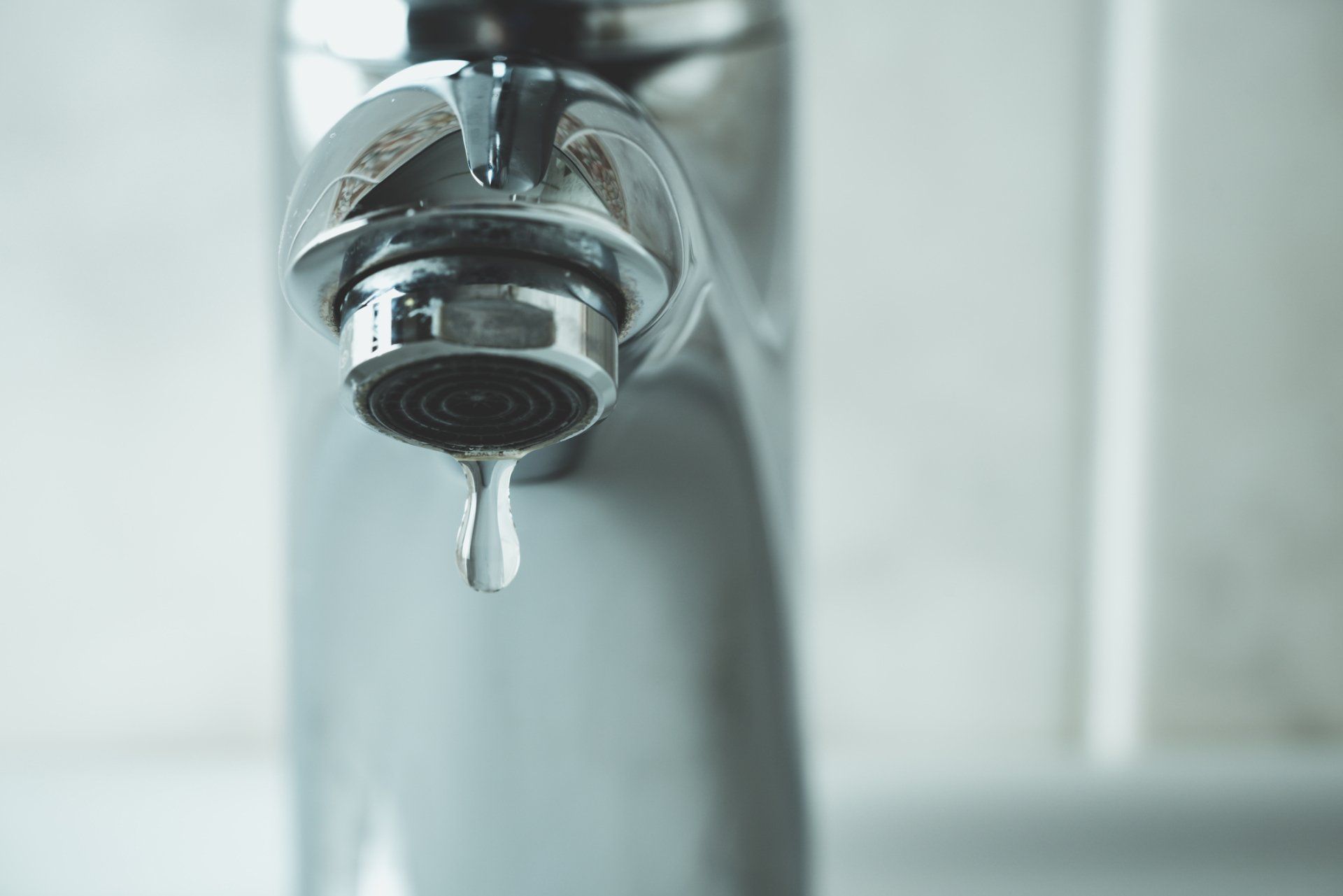 Water Drop Dripping From the Faucet — Kalamazoo, MI — Preferred Plumbing & Heating