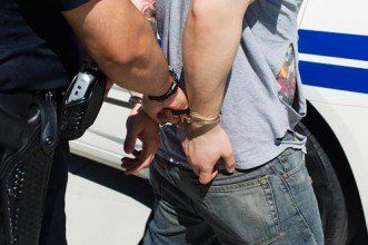 Criminal in handcuffs - Criminal defense in Oxford, MS
