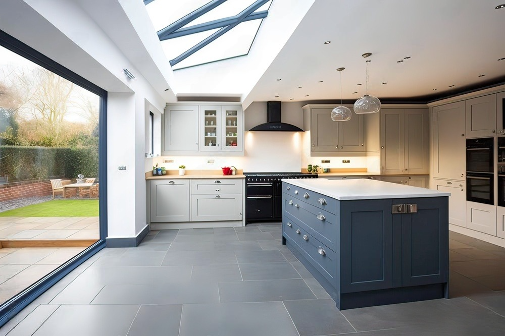 A kitchen with sliding glass doors and a large island in the middle.