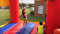 Kid playing in bounce house — Preschool & Daycare in Virginia Beach, VA