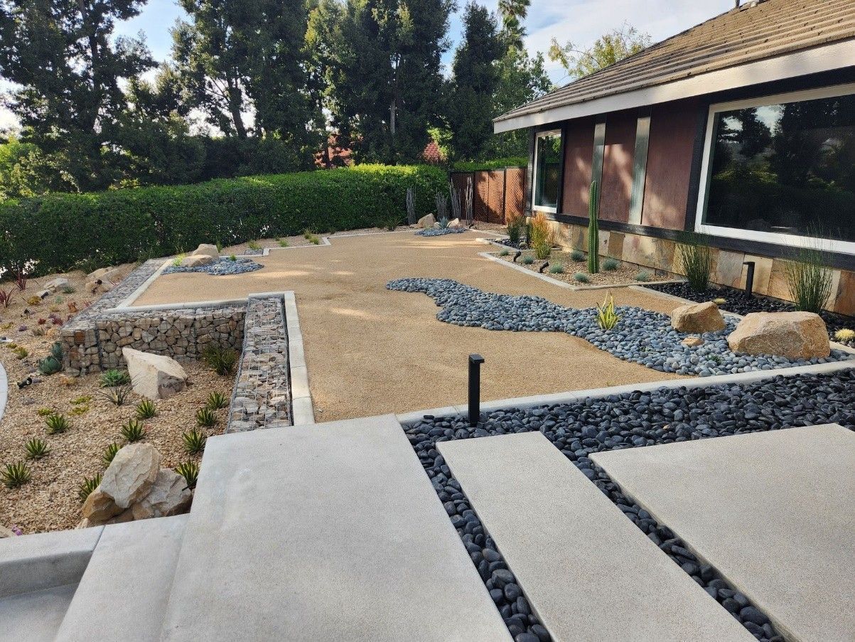 A house with a lot of rocks in front of it