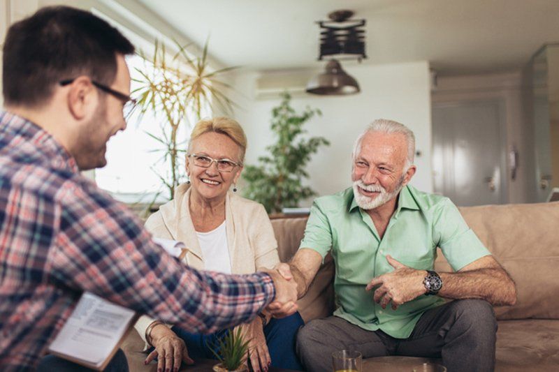 Senior Couple Talking to Expert — Phoenix, AZ — National Health & Wealth Advisors