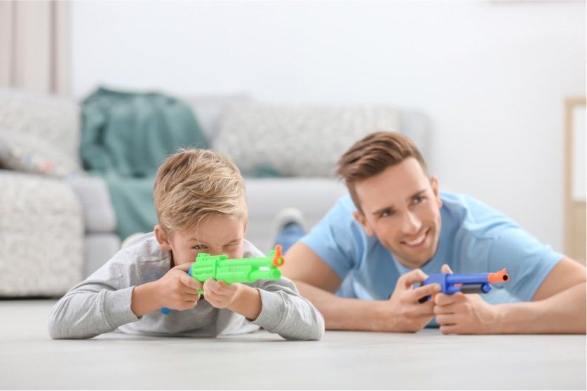 Father and son with toy guns