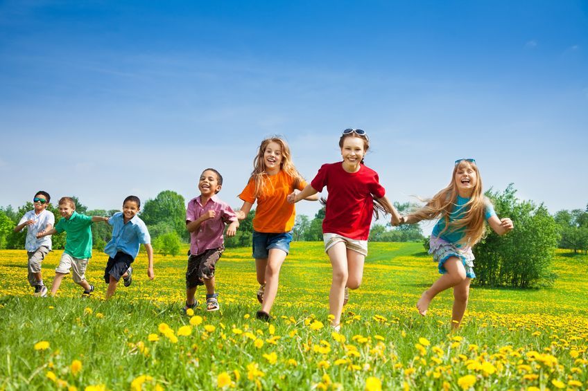 children running in a field