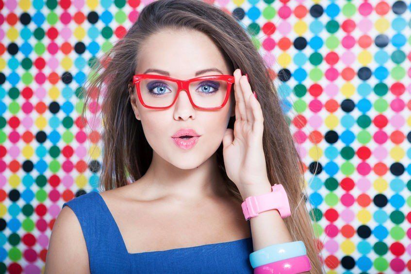 photo of a stylish woman wearing red glasses