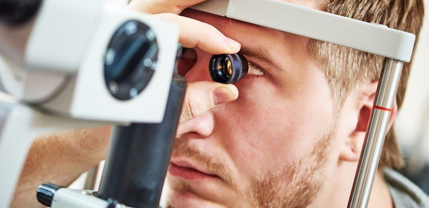 Man receiving an adult eye exam